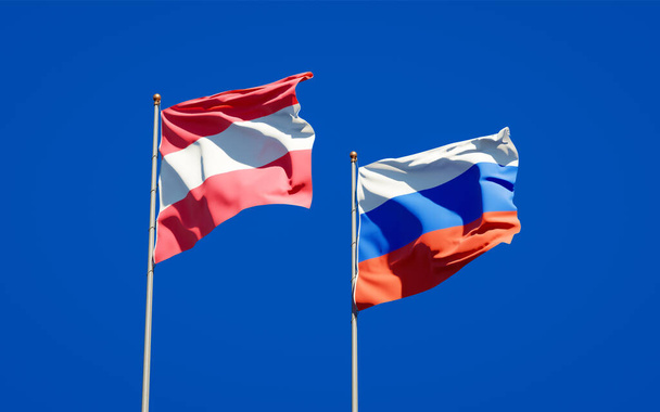 Gyönyörű nemzeti zászlók Oroszország és Ausztria együtt az ég hátterében. 3D-s művészeti koncepció.  - Fotó, kép