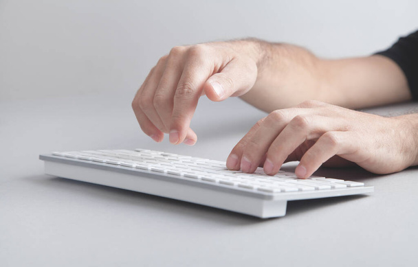 Man typing on computer keyboard. - Photo, Image