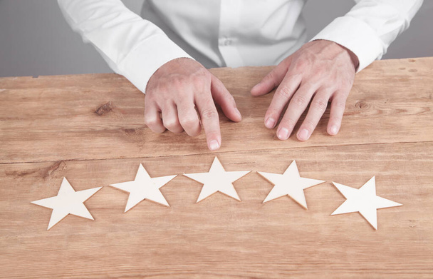 Businessman showing five star rating. Customer service experience and satisfaction - Fotoğraf, Görsel