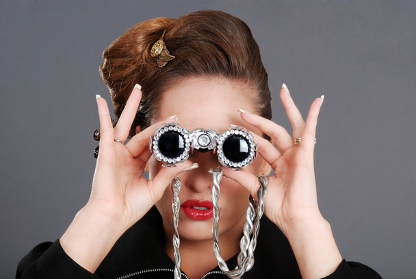 Portrait of woman using fancy binoculars - Foto, Bild