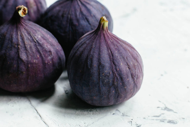 Ripe figs in a cut on a light background - Photo, image