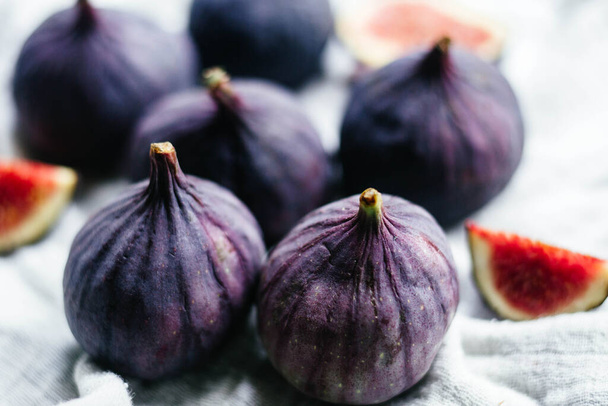 Ripe figs in a cut on a light background - Photo, image