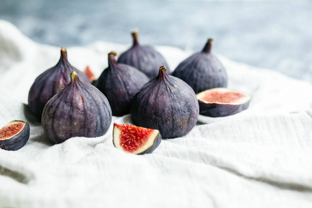 Ripe figs in a cut on a light background - Photo, Image