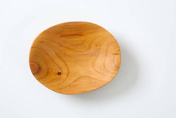 Empty oval shaped natural wood bowl - Photo, Image