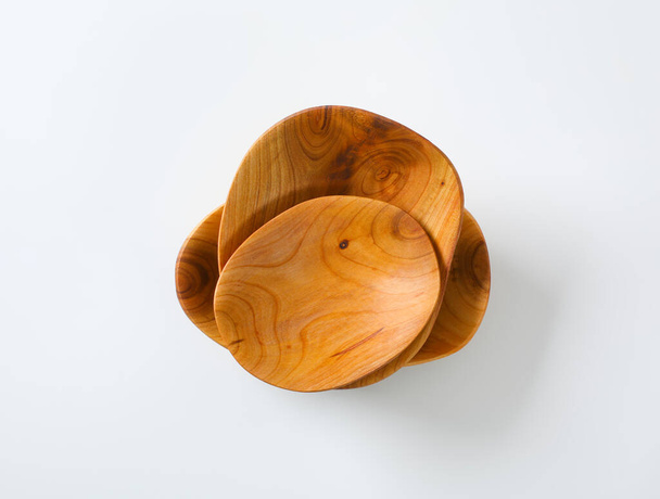 Empty handcrafted natural wood bowls - Fotoğraf, Görsel