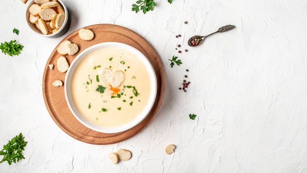 Homemade vegetable cheese soup with croutons, healthy diet vegetarian fresh organic cream soup meal food, place for text, top view. - Photo, Image