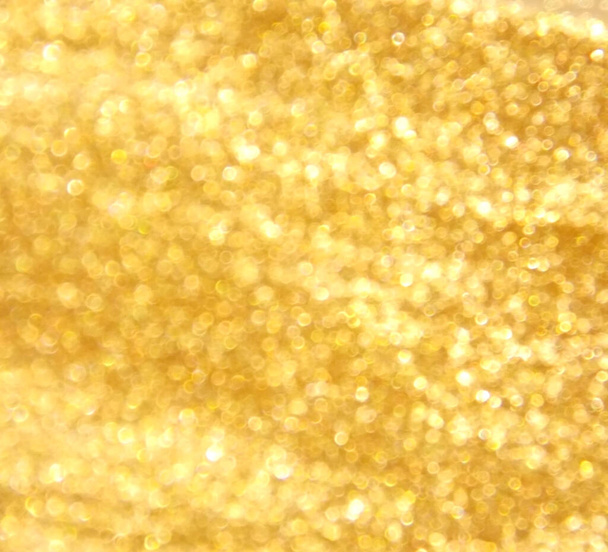 Abstract glanzend goud glitter bokeh achtergrond  - Foto, afbeelding