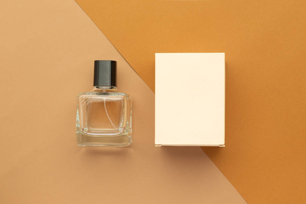 Perfume bottle and box mockup template on beige background. - Foto, Imagen
