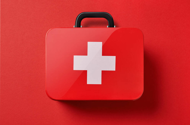 First aid kit on red background - Photo, Image