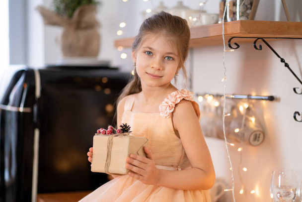 Little girl in princess dress celebrates christmas. Christmas magic fairy tale. Happy childhood. - Foto, Imagem