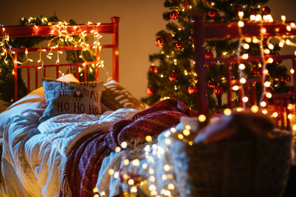 new year cozy home interior with christmas tree and garlands - Photo, Image
