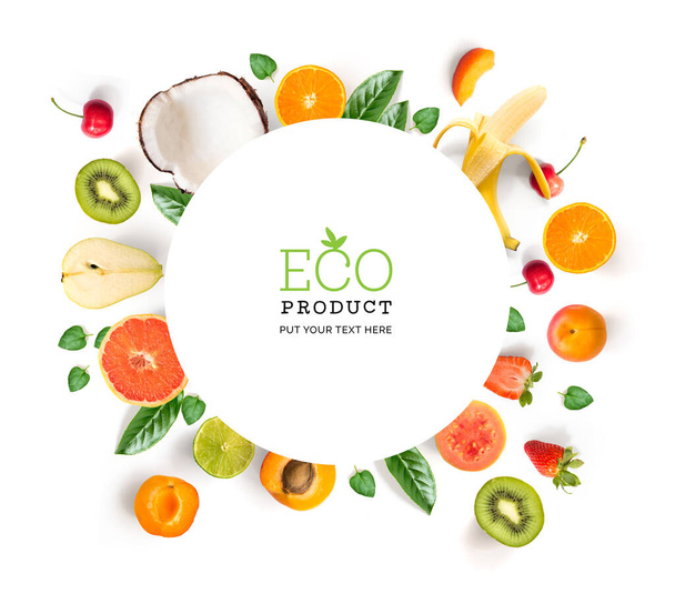 Creative layout made of tropical fruits,coconut,banana,guava,kiwi,lime,pear,strawberry cherry and apricot. Flat lay. Food concept. - Foto, immagini