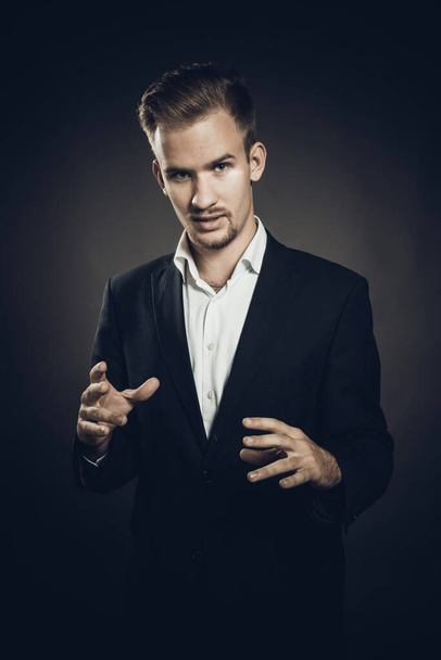 Young man dressed in suit studio portrait - Фото, зображення