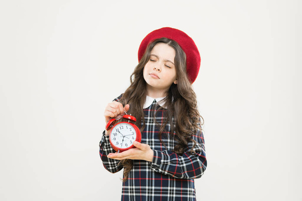 Set up alarm clock. Child little girl hold red clock. It is time. Always on time. It is never too late. Define your own rhythm of life. Happy hours concept. Schedule and timing. Girl with alarm clock - 写真・画像