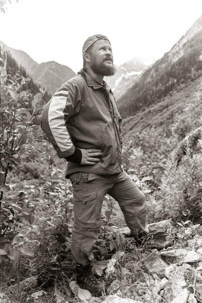 Mature travelers portrait on natural background at Caucasus mountains - Foto, imagen