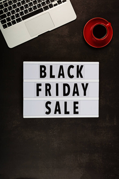 Creative promotion composition for Black friday with laptop on black background. Flat lay, top view, overhead, mockup, template. Minimal abstract background. Online shopping, sale, promo. Web banner. High quality photo - Fotó, kép