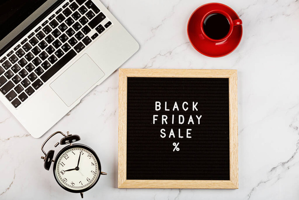 Creative promotion composition for Black friday with laptop on white background. Flat lay, top view, overhead, mockup, template. Minimal abstract background. Online shopping, sale, promo. Web banner. High quality photo - Photo, Image