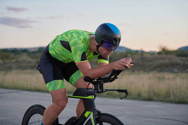 triathlon athlete riding a bike - Фото, изображение