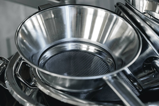 Industrial aluminum colanders on professional kitchen close up - Photo, image