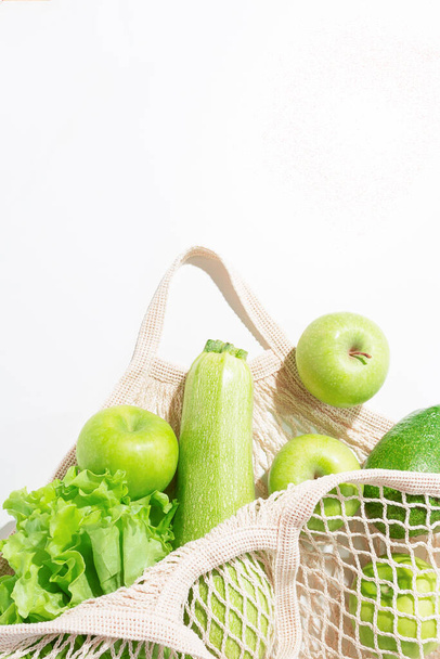 Close-up fresh green food in string bag. - Foto, Bild