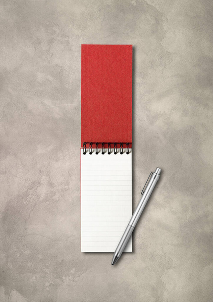 Blank open spiral notebook and pen mockup isolated on concrete background - Фото, изображение