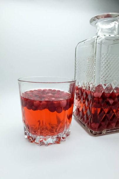 Berry alcoholic drinks concept. home-made red tincture with red berries - Фото, зображення