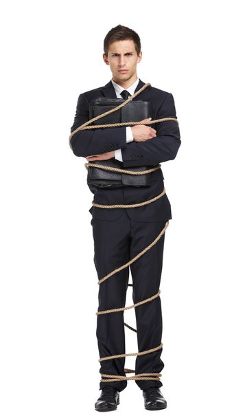 Businessman tied with the rope - Fotoğraf, Görsel