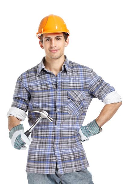 Foreman in range helmet handing hammer - Фото, изображение