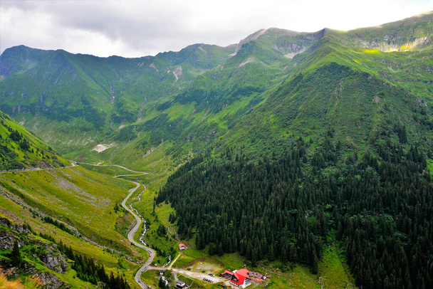 A high angle shot of forests and the Fagaras mountains in Romania - Foto, Bild