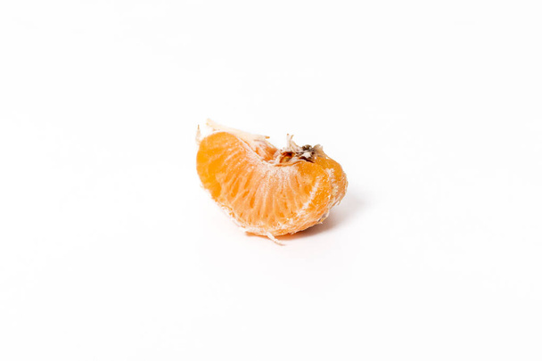 Bad moldy mandarin isolated on white background. - Foto, imagen