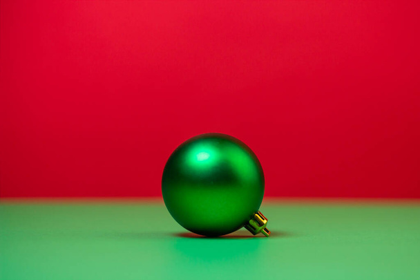 Green Christmas ball on a red background. Christmas decorations on a red background. Holiday decorations. Christmas concept. - Photo, Image