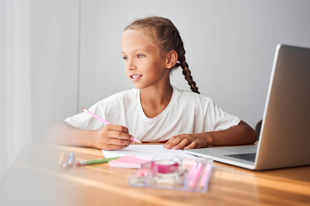 Child using pencils for drawing - Фото, зображення