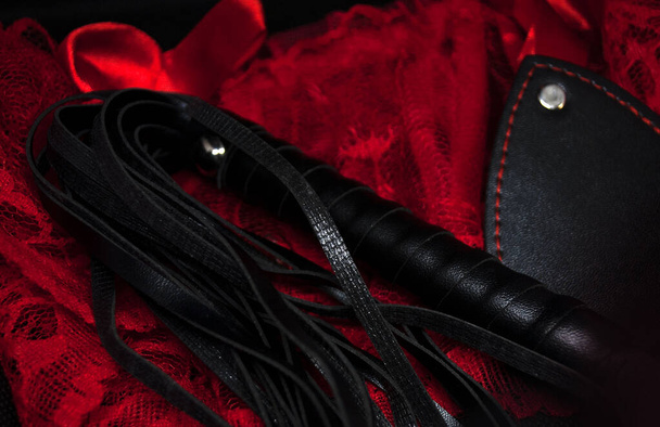 Whip, with women's sexy underwear. Submission and domination BDSM sex toy concept.The concept of passionate love and hard sex on Valentine's day. - Photo, Image