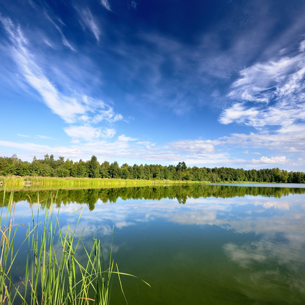 Lake landscape with beautiful reflection of a sky - Photo, Image