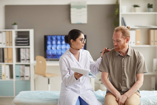 Doctor telling about disease to patient - Photo, Image