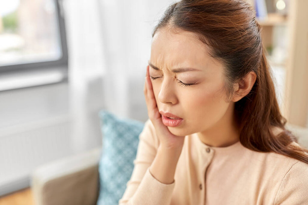 asian woman suffering from toothache at home - Valokuva, kuva