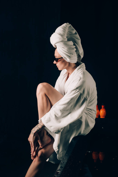 girl in a white towels, fashion portrait on a black background. Beauty retouch - 写真・画像