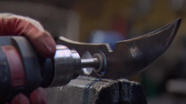 A locksmith processes a part with holes using a drill - Footage, Video