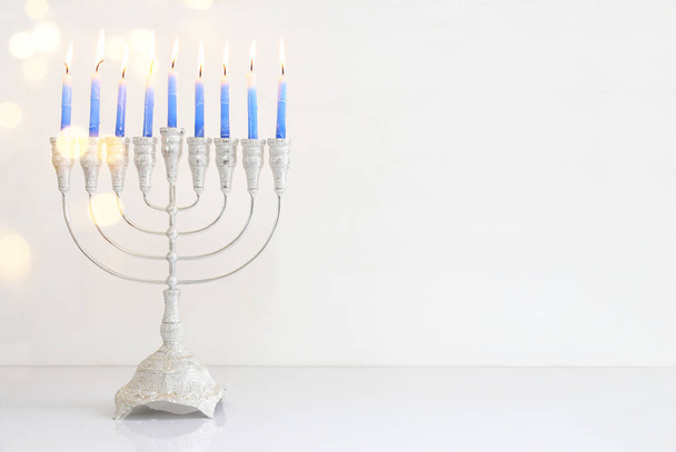 Religion image of jewish holiday Hanukkah background with menorah (traditional candelabra) and candles - Foto, imagen
