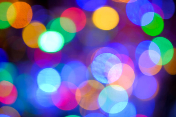 Abstract blurred multicolored of LED lights bulb at night on Christmas and Happy New Year Event, bokeh blurred background - Photo, Image