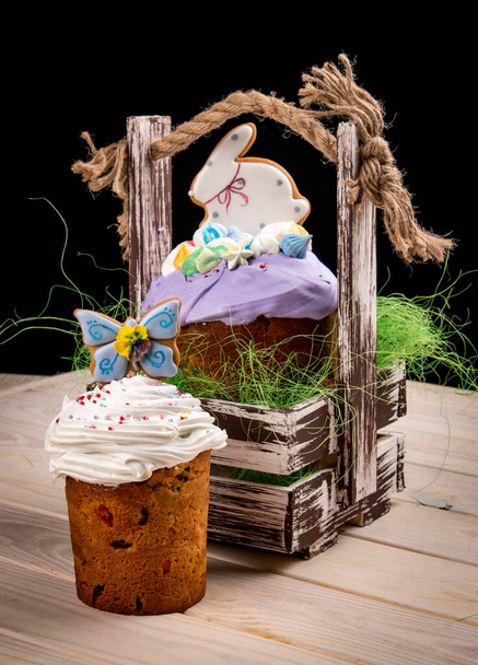 Easter composition with orthodox sweet bread, kulich and eggs on dark background.  - Foto, immagini