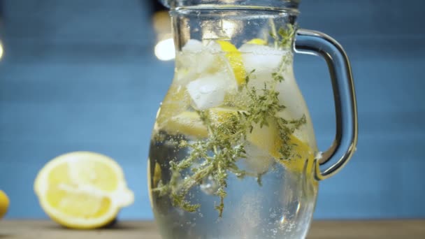 Jug with lemonade with thyme - Footage, Video