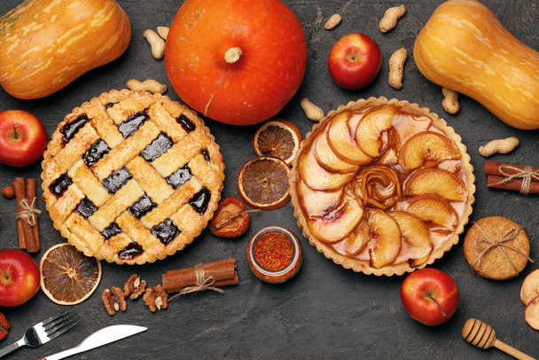 Berry tart pie and apple tart pie on black background - Foto, imagen