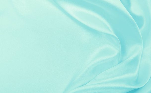 Smooth elegant blue silk or satin luxury cloth texture can use as abstract background. Luxurious background design - Фото, изображение