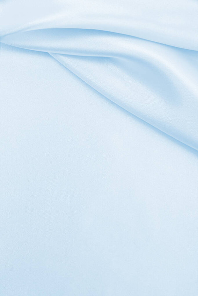 Smooth elegant blue silk or satin luxury cloth texture can use as abstract background. Luxurious background design - Photo, image
