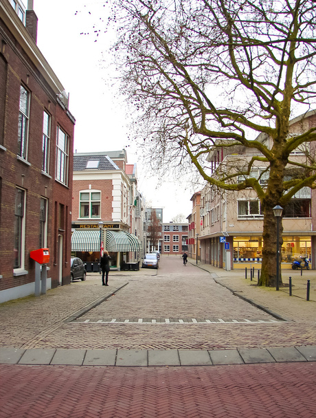 People walk in the Dutch town in Gorinchem. Netherlands. - Zdjęcie, obraz