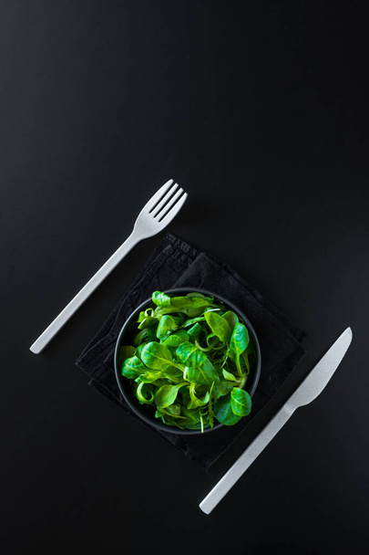 A vertical shot of green leaves canonigos and rucula, to make salads - Zdjęcie, obraz