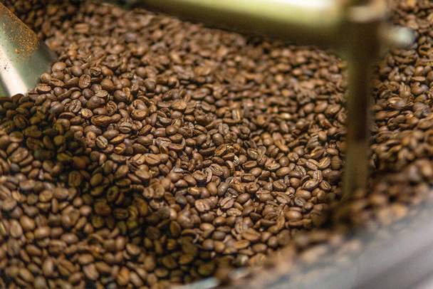 A high angle shot of coffee beans in the factory - Φωτογραφία, εικόνα