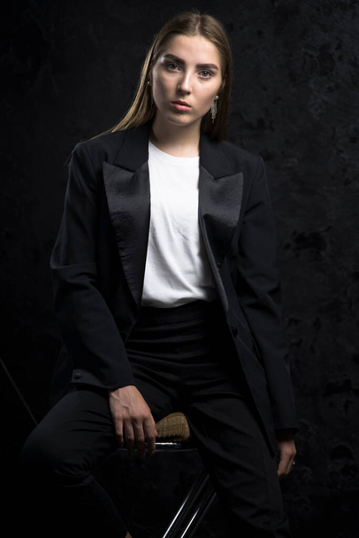 Young fashion woman model posing in stylish clothes. - Valokuva, kuva