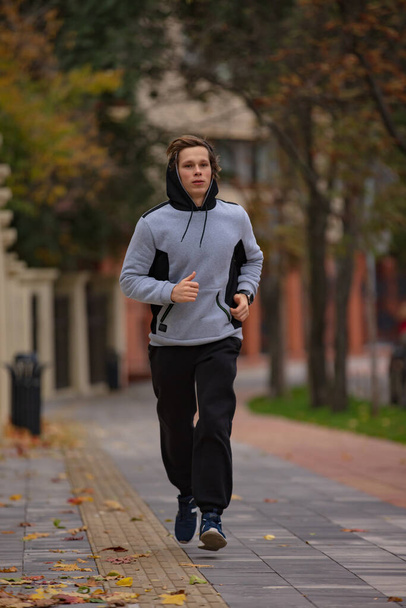 Man jogging in a park - Photo, image